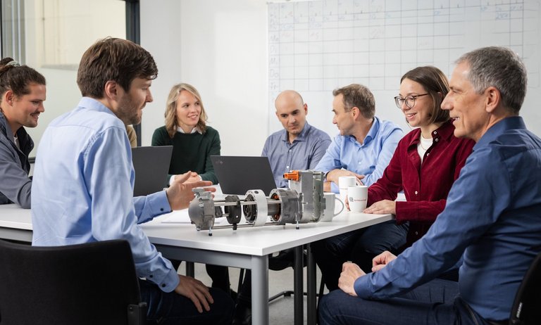 Group of TLK employees Group of TLK employees in a discussion